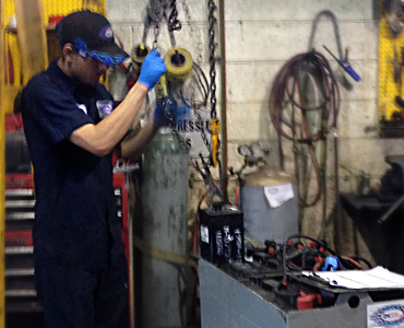 Pulling a battery cell at the shop.